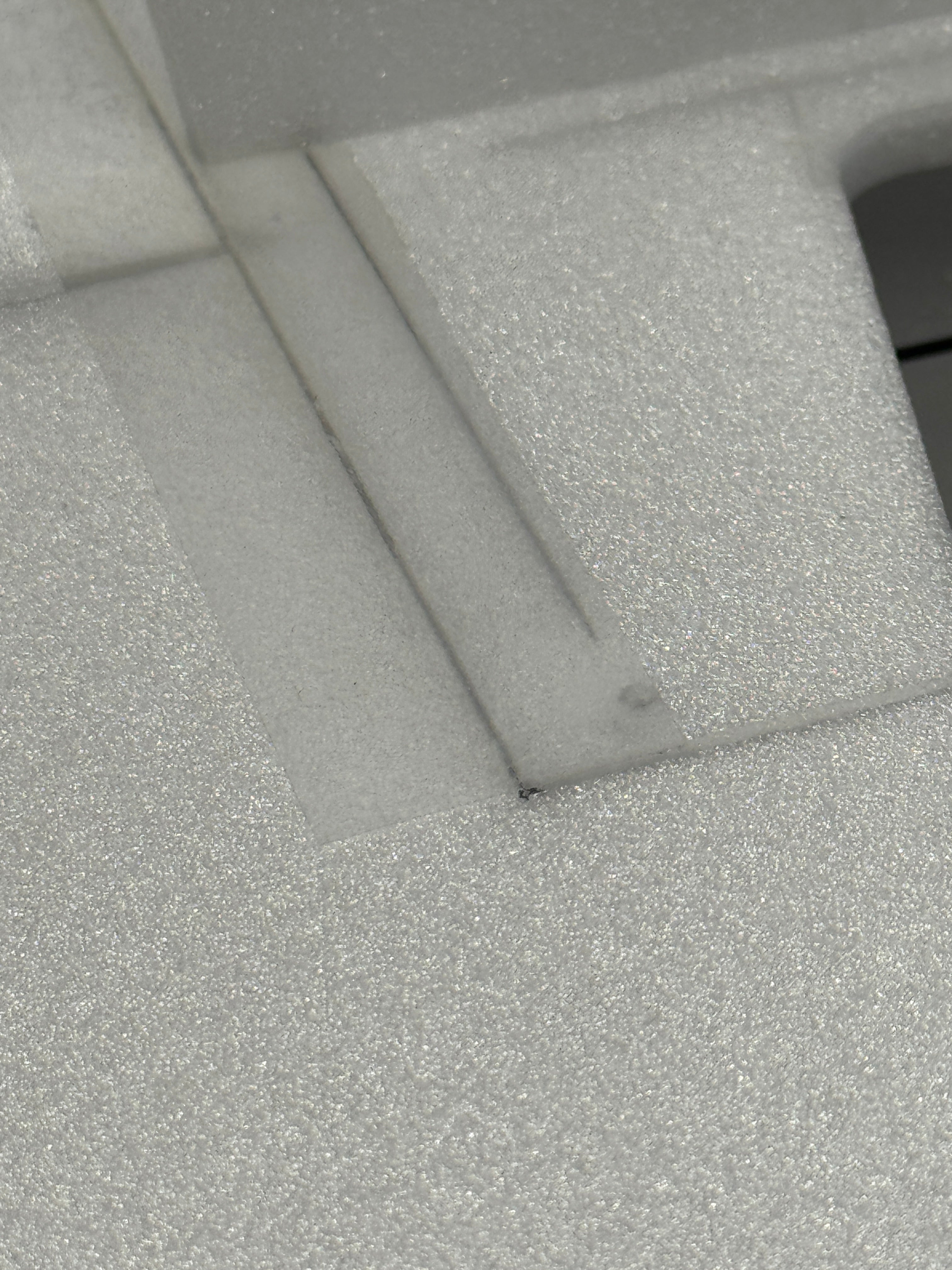 Close-up of white foam with a textured surface