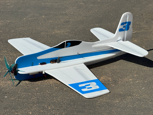 A RC Plane sits on the ground