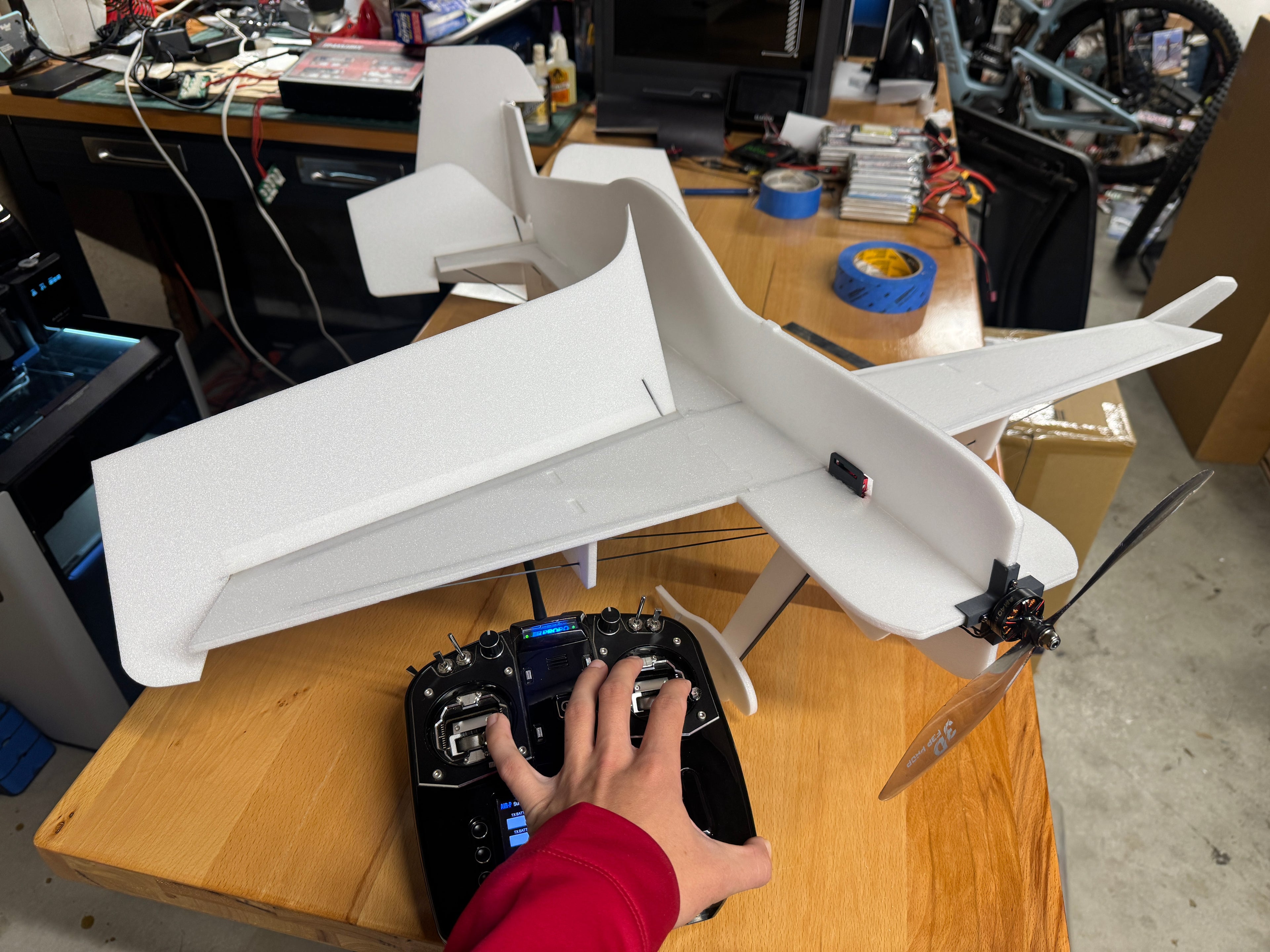 Person operating a rc transmitter and model airplane