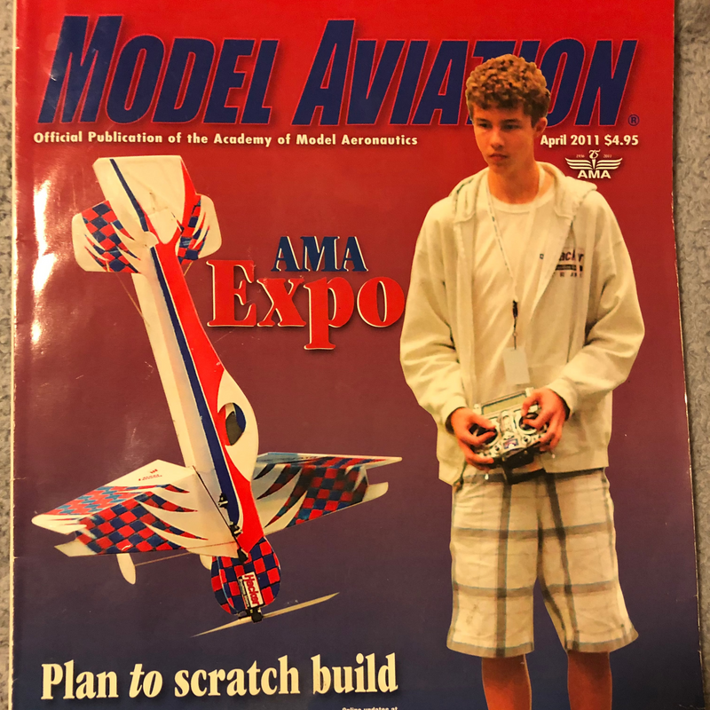 Model Aviation magazine cover with a model airplane and Matt Stringer holding a radio control device, featuring the AMA Expo 2011