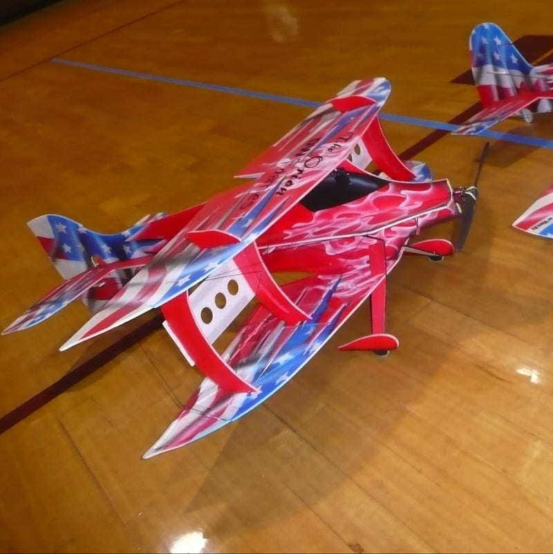 Biplane model airplanes on a wooden floor
